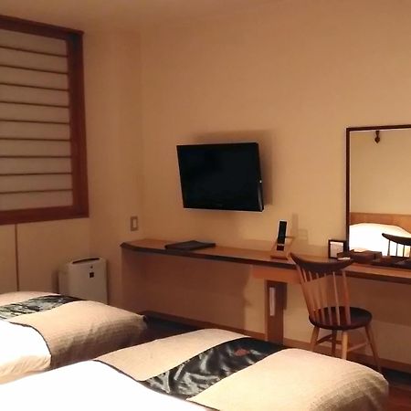 Niseko Konbu Onsen Tsuruga Moku-No-Sho Hotell Rom bilde